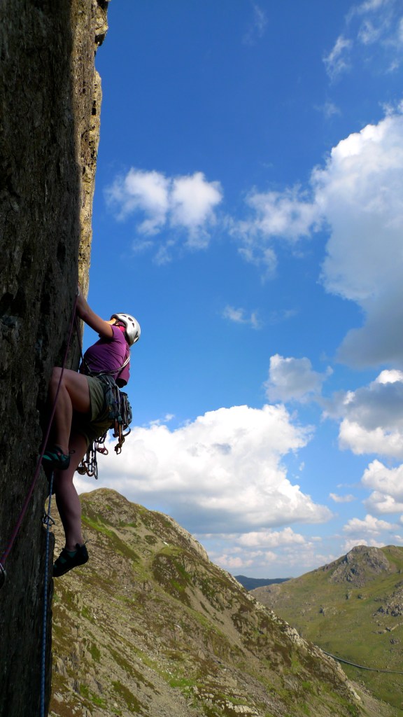 The Wild Country Aurora Women's Ziplock Harness has 5 gear loops. well placed to handle a lrage rack of trad gear. Seen here used on the North Wales classic E1, Cemetery Gates.
