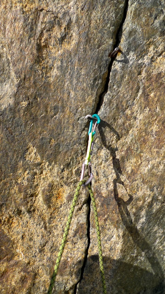 Edelrid 19G Quickdraw clipped into a piton.