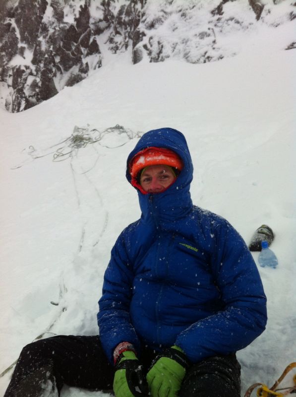 Warming up in my Patagonia DAS Parka after bailing from a route in bad weather.
