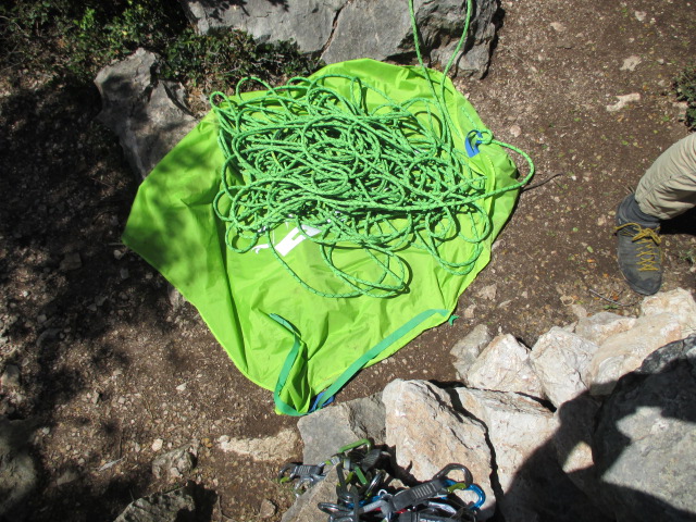 The detachable tarp was very useful. There is a strap to help keep it wrapped in the pack.