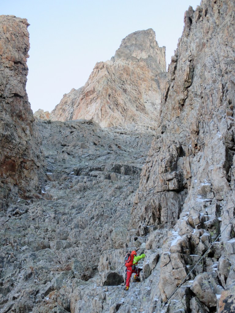 Arc'teryx Alpha FL Jacket - battling icy and rough rocks in the Dumhel Couloir during a traverse od La Meije, Ecrins, France.
