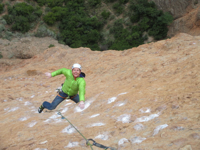 Climbing in the Arcteryx Cerium SL Jacket on a cold day in Riglos, Spain.