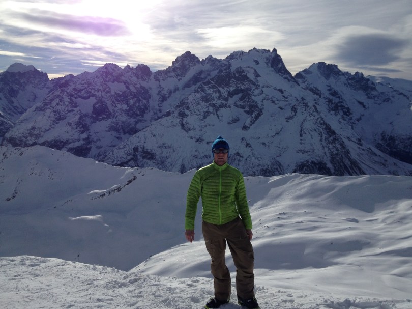 Wearing the Arcteryx Cerium SL Jacket whilst on a short summit stop, ski touring in the Ecrins, France.