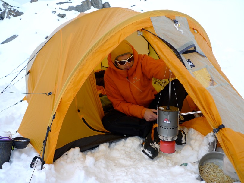 MSR Reactor Stove - using the hanging kit to melt snow in the tent porch.