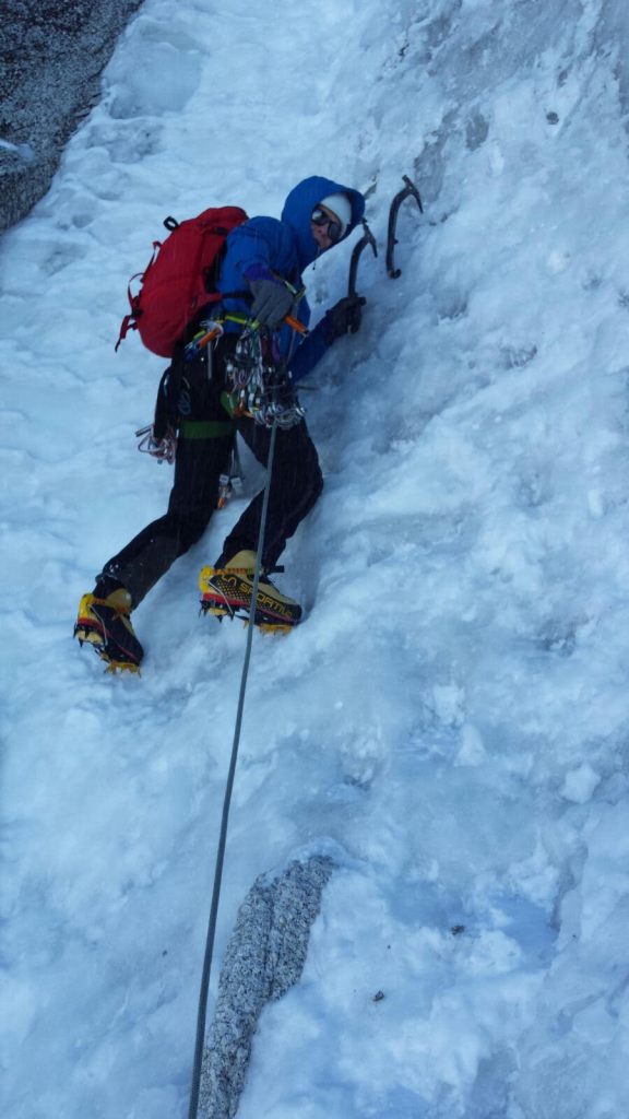 Stopping to place a Petzl Laser Speed Light Ice Screw on the Chere Couloir, Mont Blanc Du Tacul.