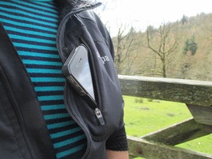 The small 'media' pocket was plenty big enough for my smartphone. It has a headphone slot on the inside.